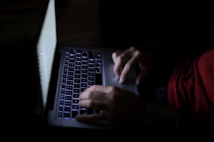 man looking at laptop